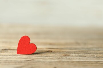 Fototapeta premium Red decorative heart on wooden table, space for text. Happy Valentine's day