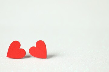 Obraz premium Red decorative hearts on white background, space for text. Happy Valentine's day