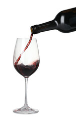 Pouring wine into glass on white background