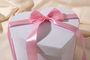 Beautiful wedding gift on silk fabric, closeup