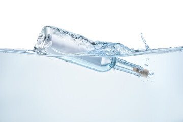 Corked glass bottle with rolled letter in water on white background