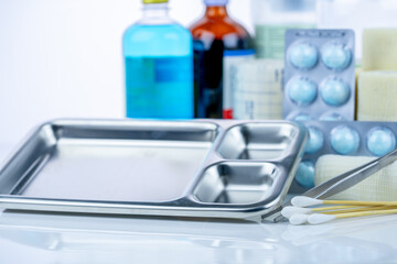Medical equipment for treating infections. Wound care dressing set. Medical supplies for nurses. Conform bandage, forceps, cotton stick, alcohol. Sterile dressing materials. Healthcare equipment.