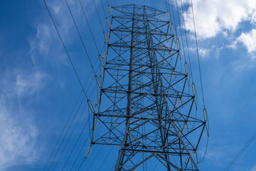 High voltage electrical transmission tower infrastructure delivers essential power across national...