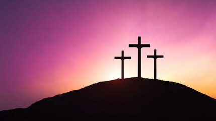 Three crosses silhouetted on hilltop at sunset symbolizing faith and christianity