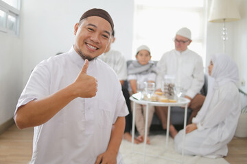 Portrait Of Young Muslim Man Giving Thumb Up During Eid Celebration 