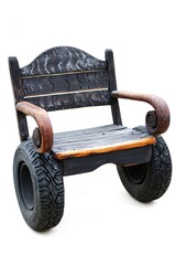 Fototapeta premium Rustic wooden bench with tire wheels, outdoor setting, recycled materials, park furniture