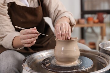 Hobby and craft. Woman making pottery indoors, closeup