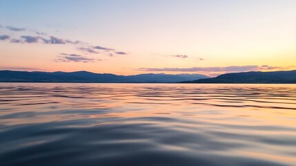 Obraz premium Idyllic Sunset Over Calm Waters with Gentle Hills in the Distance : Generative AI