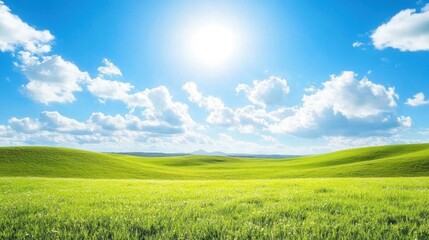 Obraz premium Serene Landscape of Lush Green Hills and Meadows under a Clear Blue Sky with Fluffy White Clouds