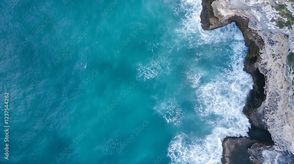 Poster aerial view of rocky coastline with crashing waves and vibrant blue ocean textures : generative ai