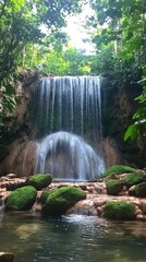 A serene waterfall cascades over rocky terrain, surrounded by lush greenery and moss-covered stones in a tranquil natural setting.