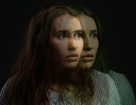 Mental health, woman and face in studio with double exposure, fear and bipolar disorder. Patient, anxiety and overlay on black background with worry, scared and paranoia with stress in psychology