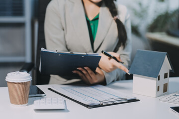 Home and real estate trading business. Real estate agent giving keys to house woman owner..