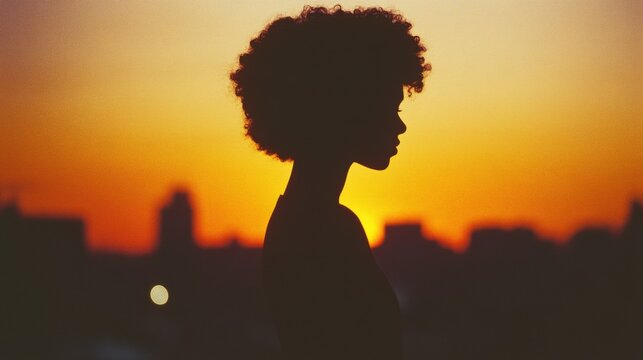 silhouette of woman at sunset