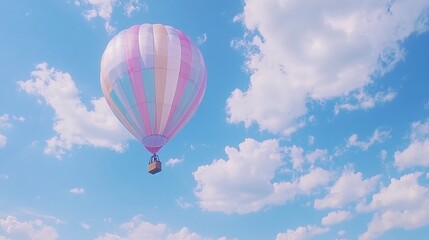 Obraz premium Pastel Hot Air Balloon Soaring Through Blue Sky
