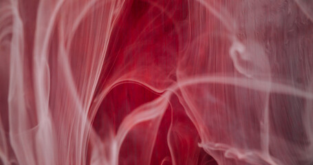 Pouring paint drop. Blur ink water. Defocused white red color shine liquid fluid smoke mist texture...