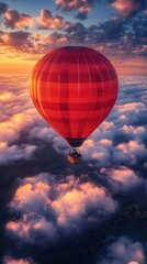 Obraz premium Red Hot Air Balloon Soaring Above Clouds at Sunrise