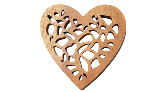 Intricately carved wooden heart with transparent background