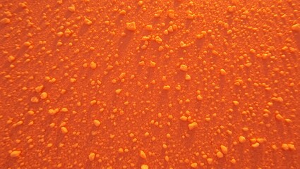 Rough textured orange surface with organic details, ideal for rustic and vintage-style designs and backgrounds