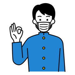 マスクをしてOKサインをする男子学生