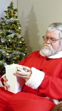 Santa claus eating popcorn while watching television