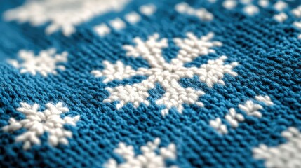 Fototapeta premium Traditional blue knitted sweater pattern with Nordic snowflakes, soft close-up