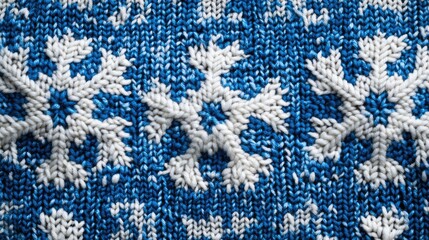Winter holiday background with a knitted blue and white snowflake pattern