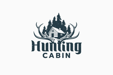 Fototapeta premium hunting cabin logo with combination of a log house, deer antler and pine forest. It is good for cabin rental, lodge, adventure business etc.
