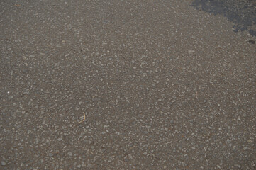 Background of gray asphalt rocks in the city