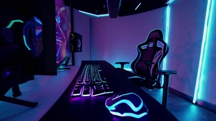 A futuristic gaming setup with neon blue lights, ergonomic chairs, and multiple screens, creating an immersive environment for modern gaming and entertainment