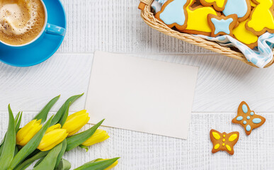 Easter Bunny-Shaped Gingerbread Cookies, Yellow Tulips, and Coffee Cup