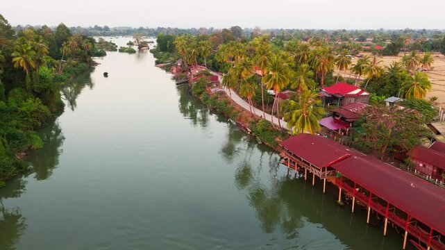 Aerial establishing of Four Thousand Islands, Si Phan Don village in Laos traditional houses by the Mekong River