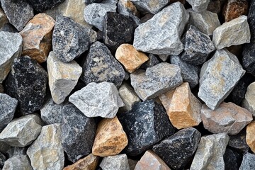 Variety of gravel stones in different shapes and colors displayed in a close-up view suitable for landscaping and construction