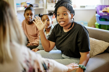 Child psychology, therapist and parent consultation with mother, children and family counseling. Communication, mom and kids with childcare psychologist talking about little girls in discussion