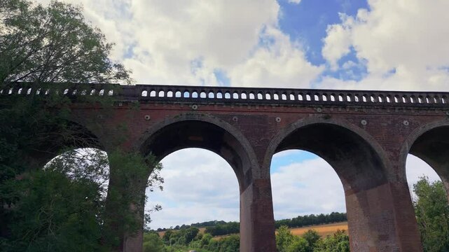 Historic brick bridge towering over the River Darent in scenic Kent