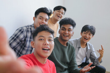 Selfie of Group Happy Diverse People Taking Photo With a Phone
