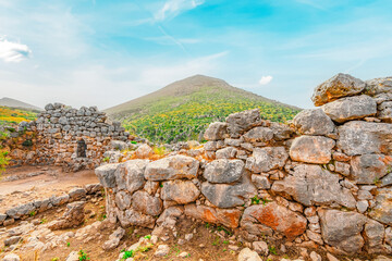 The archaeological site of Mycenae with ancient tombs, giant walls and lions gate, Peloponnese, Greece
