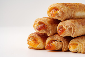 Delicious sweet pastries stacked high showcasing a golden filling in a bakery setting