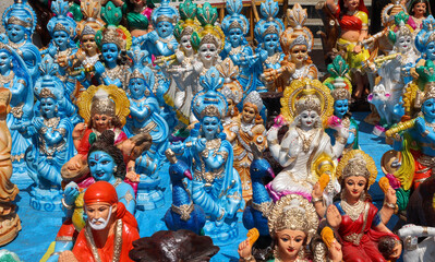 Clay dolls of Mythological Hindu deities, Sri Krishna, Shiva, Ganesh, Saraswathi, Lakshmi, Durga, handmade and painted in vibrant colors in India.