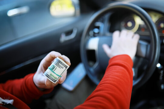 dollars with a car key lie in inside cars. financial concept