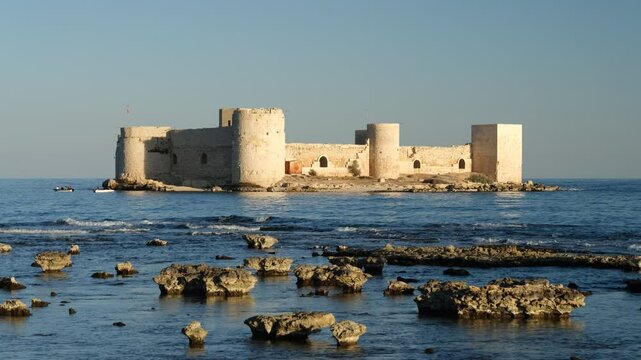 The view of the historical Maiden's Castle ( Turkish; Kız kalesi ) on a beautiful day. Mersin province, Turkey - 4k video 