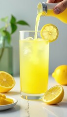Fototapeta premium Lemon juice spills onto a white surface as a refreshing cocktail is poured, background, juice