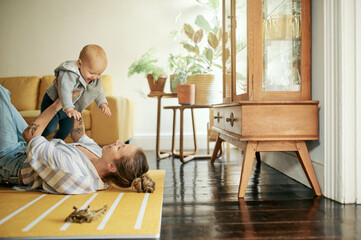 Family, play and mama lift baby in home for bonding, quality time and relax together on floor....