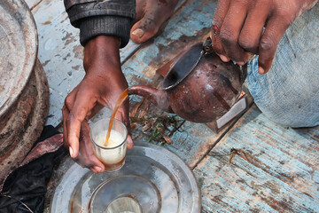 A cup of hot aromatic tea on the vintage fishing boat in Atlantic ocean, Mauritania, West Africa