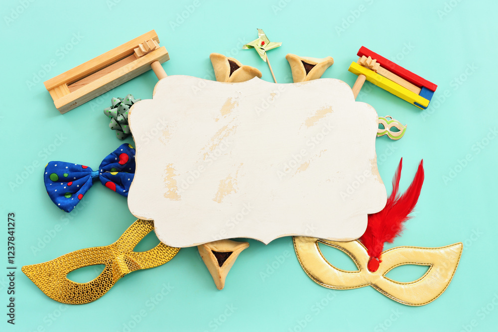 Wall mural Purim celebration concept (jewish carnival holiday) over blue background