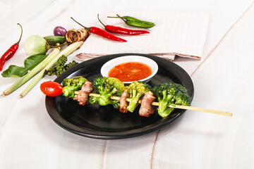 Thai Street foof satay with bacon and broccoli