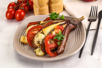 Baked tomato with mozzarella and tomato