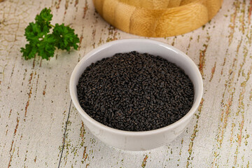 Black dry Nigella seeds in the bowl