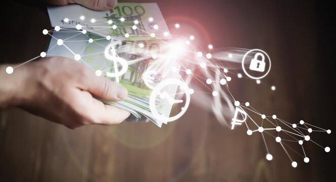 Abstract media background. European Union banknotes in hands. A pack of 100 euro banknotes in the hands. Cash transfer.