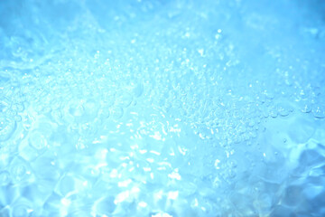 Blue water texture. Bubbles and bubbling water.
